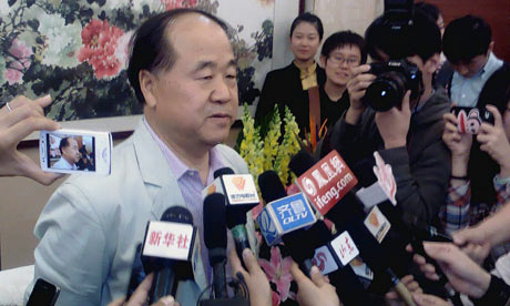 Chinese writer Mo Yan talks to the media during a news conference in Gaomi